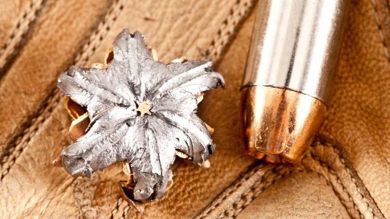 bullet, close up, mushroom bullet, open point, dumdum, discharged bullet, leather (horizontal)